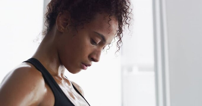 Where strong bodies are sculpted. Fitness, rest and breathing, woman in gym for workout, motivation and Meg. sweat wtih rest and fatigue, girl athlete with challenge.