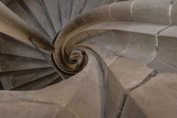 Bottom view of a historic spiral staircase.