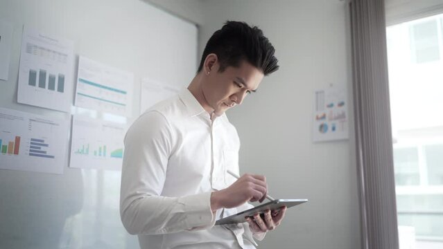 Businessman using digital tablet create business idea at home office.