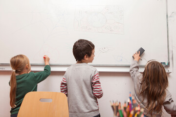Obraz premium children drawing on a white board