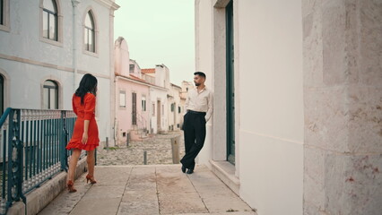 Woman dancer approaching man starting dance latin american style on street.