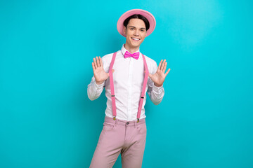 Photo portrait of attractive young man touch fix suspenders fashion model wear trendy pink clothes...