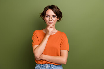 Portrait of intelligent businesswoman touch chin wear orange t shirt professional data analytic...