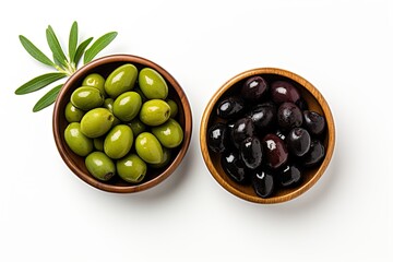 Olives in wooden bowls on white seen from above with text space