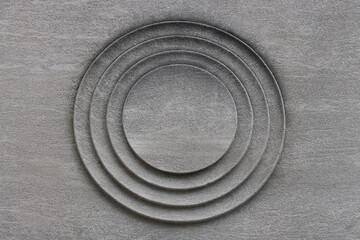 a circular medallion in concrete, a molded decorative architectural detail, nice background