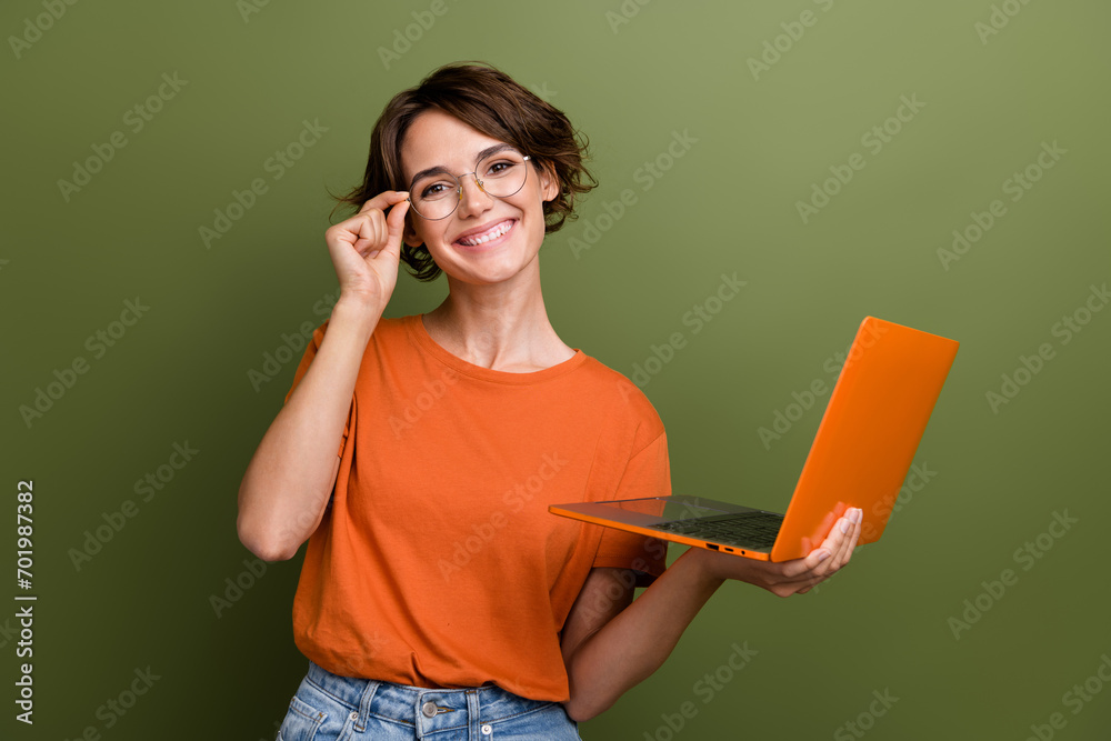 Aufkleber portrait of young successful businesswoman hold netbook touching eyeglasses when deciding new projec