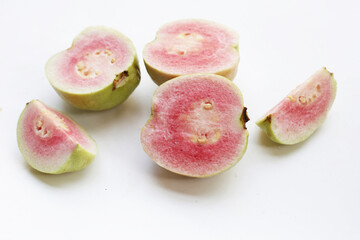 Fresh pink guava on white background.