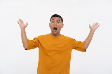 Fototapeta premium Asian man in an orange shirt with a smiling, surprised, and shocked expression