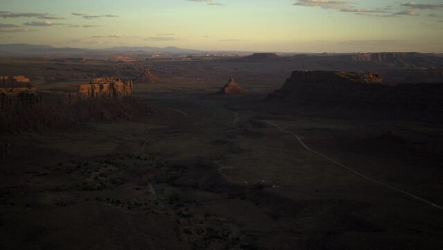 Canyon of desert rock formations at sunset