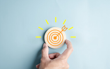 Hand holding to target objective with idea creative light bulb icon. planning development...