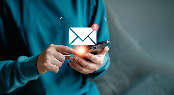 Businesswomen using smartphones check New email notifications and business digital online marketing. Inbox receiving electronic message alert. icon envelope virtual screen, communication technology.