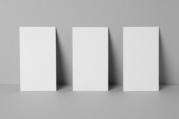 Blank business cards on light gray background. Mockup for design