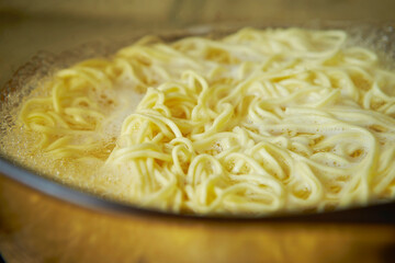 Boil noodles in boiling water