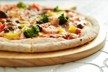 pizza on a wooden board	