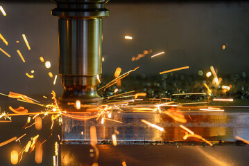 The burning chip from wear cutting tools on CNC milling machine.