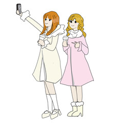 冬コートを着てドリンク片手に記念写真をとる女の子たち