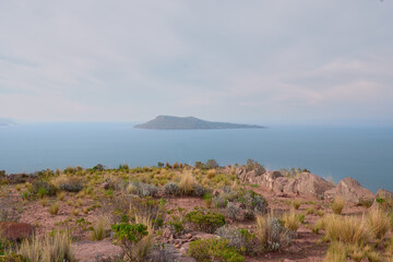 Photo taken from Taquile Island, in the distance, Amantani Island is seen surrounded by the waters...