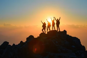 Foto op Plexiglas The silhouette of a family facing the rising sun on a mountain, their posture and unity a testament to their success and the enduring power of teamwork and familial support. © Lucija
