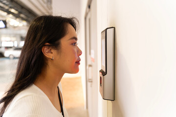 Futuristic and technological scanning of the face of a beautiful business woman for facial recognition can serve.