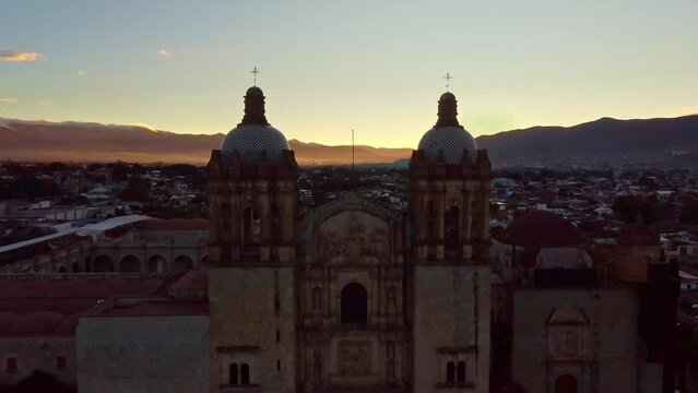 backwards drone shot of Santo Domingo temple in downtown Oaxaca city in Mexico