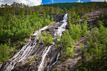 Waterfall cascading down mountain in Norway