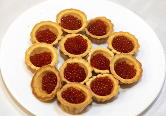 Tartlets with red caviar