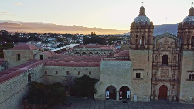 backwards drone shot of Santo Domingo temple in downtown Oaxaca city in Mexico