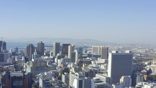 Drone, buildings and city with skyline, outdoor landscape in Cape Town with location and geography. Urban infrastructure, cityscape background with Earth and aerial view of street and architecture