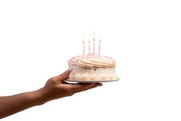 Hand holding a birthday cake with buttercream and colorful candles isolated on a transparent background. PNG file.