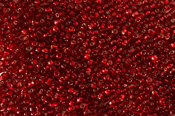 Abstract background from red beads close-up.