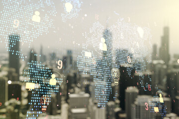 Double exposure of social network icons interface and world map on blurry office buildings...