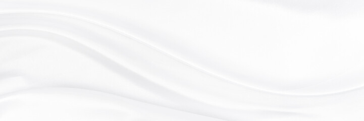 White gray satin texture that is white silver fabric silk panorama background with beautiful soft...