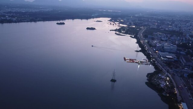 Sunset view of Kovai Lake, Coimbatore city under hazy sky due to air pollution, Tamil Nadu, India