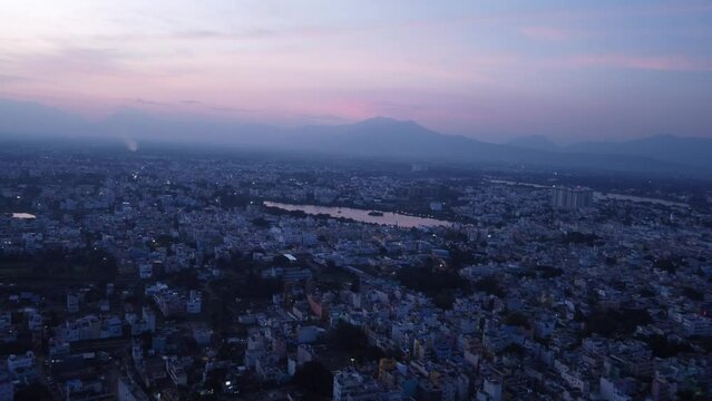 Panoramic aerial view of Coimbatore city under hazy sky at sunset, Tamil Nadu, India
