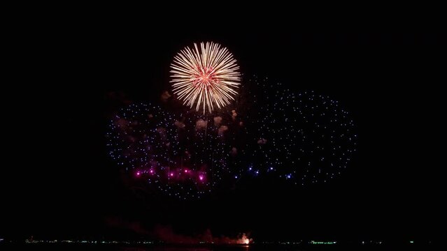 Large number of photos of fireworks during New Year's Eve being shot on the coast