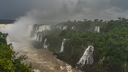 Breathtaking tropical waterfall landscape. Many streams of water collapse into the bed of a stormy...
