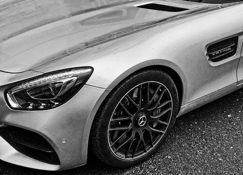 Kaliningrad, Russia - OCTOBER 31, 2023: Front on view of a Mercedes-Benz AMG GTS 510 sports car are parked in courtyard. Image contain noise or grainy. 