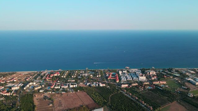 Aerial 4K drone footage of Kiriş-
Kemer (Antalya, Turkey).  Mediterranean sea, beach, cityscape (hotels and resorts), and mountains &ndash; filmed in a vibrant summer time.