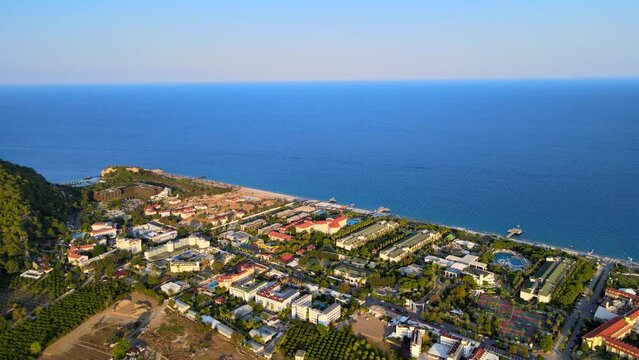 Aerial 4K drone footage of Kiriş-
Kemer (Antalya, Turkey).  Mediterranean sea, beach, cityscape (hotels and resorts), and mountains &ndash; filmed in a vibrant summer time.