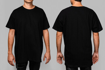 Front and back views of a man wearing a black, oversized t-shirt with blank space, ideal for a mockup, set against gray background - Powered by Adobe