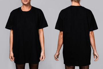 Front and back views of a woman wearing a black oversized t-shirt with blank space, ideal for a mockup, set against gray background - obrazy, fototapety, plakaty
