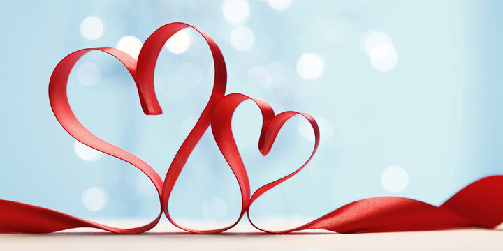Hearts made from red ribbon. Valentine's card