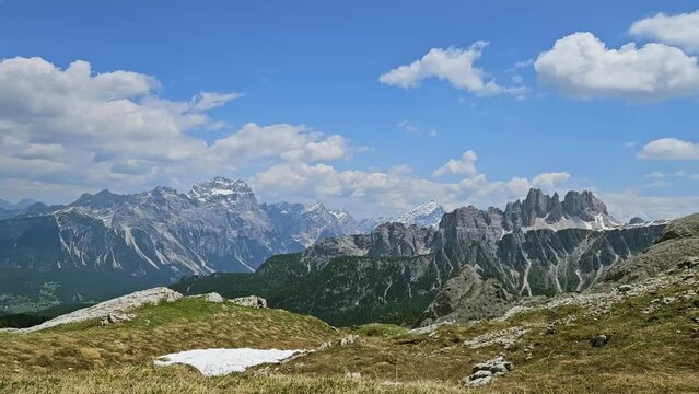 Time lapse video of Punta Sorapiss and other mountains around Cortina d'Ampezzo in Italian Dolomites. Sunny day, white clouds passing by.