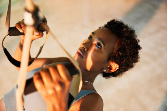 Woman doing suspension training in a gym