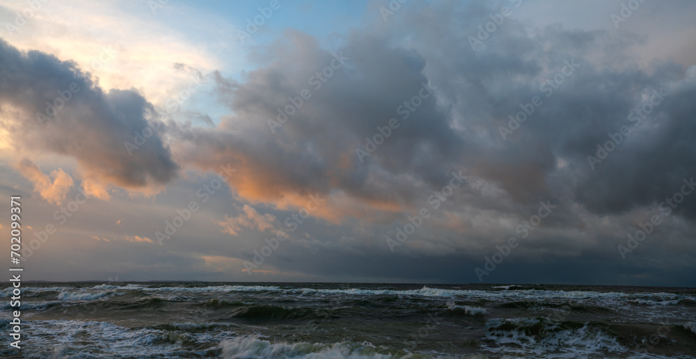 Wall mural panorama of storm clouds over the sea during sunset