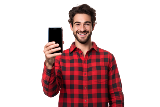 Cheerful man wearing a red plaid shirt holding a large mobile phone in his hand. Isolated on a transparent background. Png file.