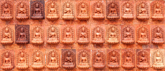 Red wall texture with Chinese Buddha