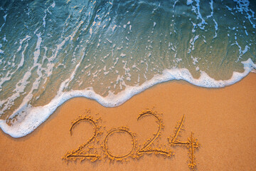 Happy New Year 2024 Text on Tropical Beach Sand and Turquoise Water Wave of Caribbean Sea at Sunrise