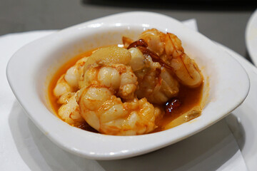 Close up Gambas al Ajillo, Spanish Garlic Shrimp with olive oil and dried chili- Classic Tapas