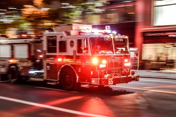 Foto op Plexiglas New York, NY USA Fire truck with emergency lights on the street of Manhattan © Martin